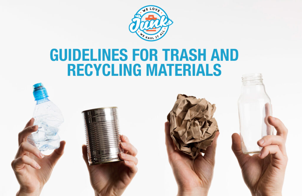 Hands holding recyclable materials including plastic bottle, metal can, paper, and glass bottle for trash and recycling materials