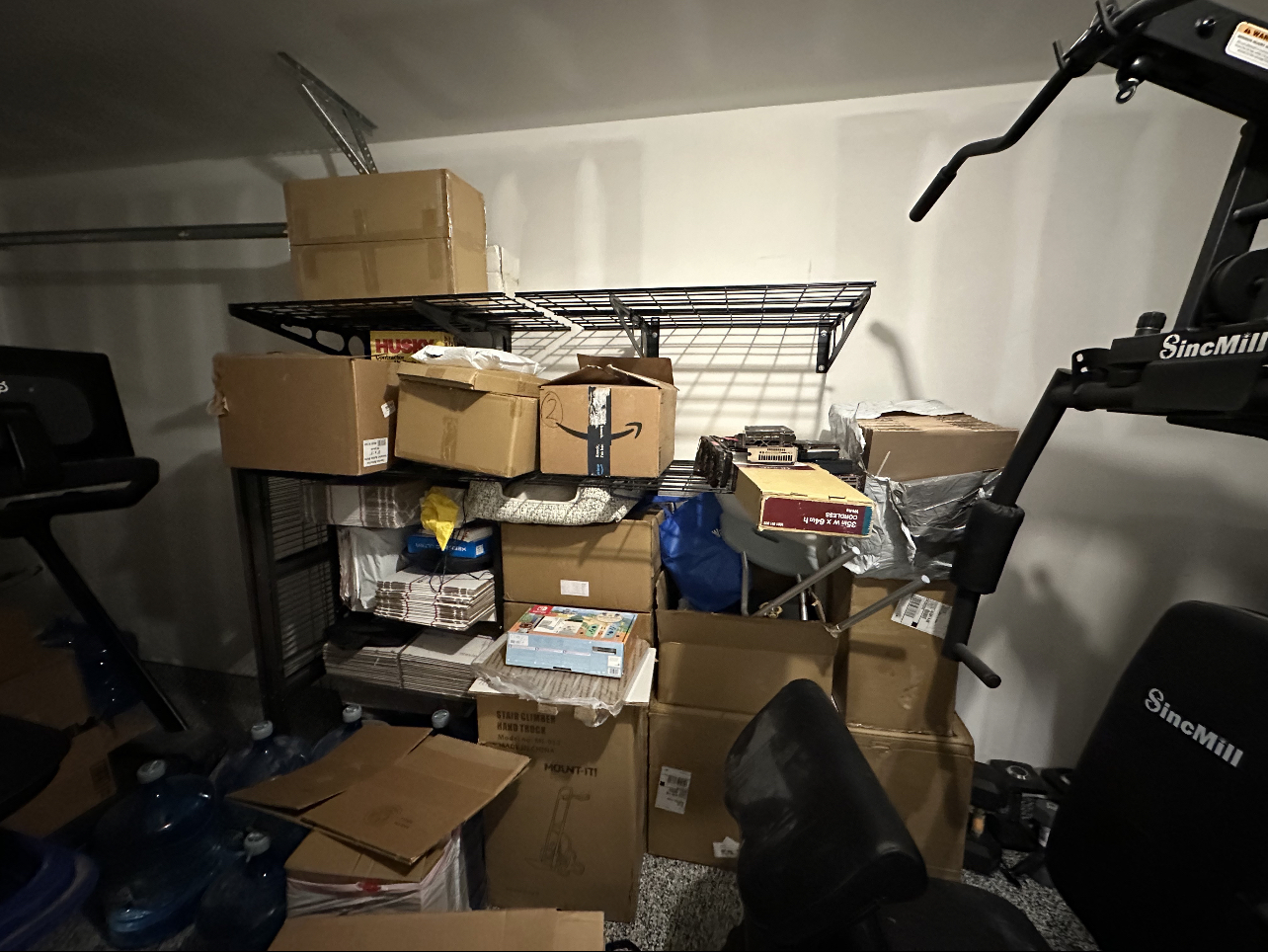 Cluttered garage filled with boxes and household items