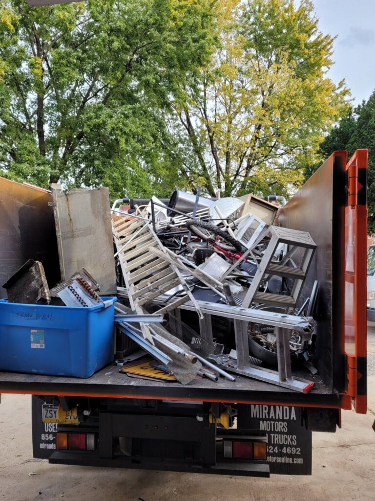 Bathroom demolition debris loaded onto cleanup truck